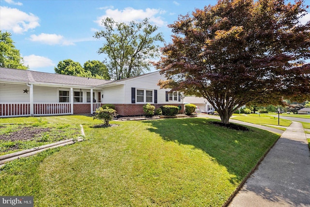 8413 Hallmark Cir, Baltimore, MD 21234 - view of front facade with brick siding, a front yard, and a porch