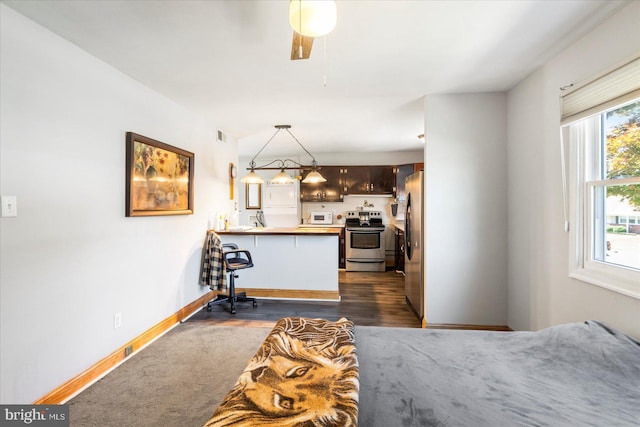 8413 Hallmark Cir, Baltimore, MD 21234 - kitchen with appliances with stainless steel finishes, a peninsula, ceiling fan, decorative light fixtures, and dark wood-type flooring
