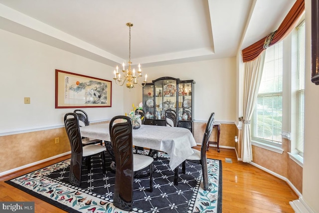 2363 Ashford Dr, Waldorf, MD 20603 - dining room with a chandelier, hardwood / wood-style floors, and a tray ceiling