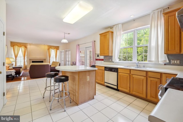 2363 Ashford Dr, Waldorf, MD 20603 - kitchen featuring dishwashing machine, open floor plan, a center island, and light countertops