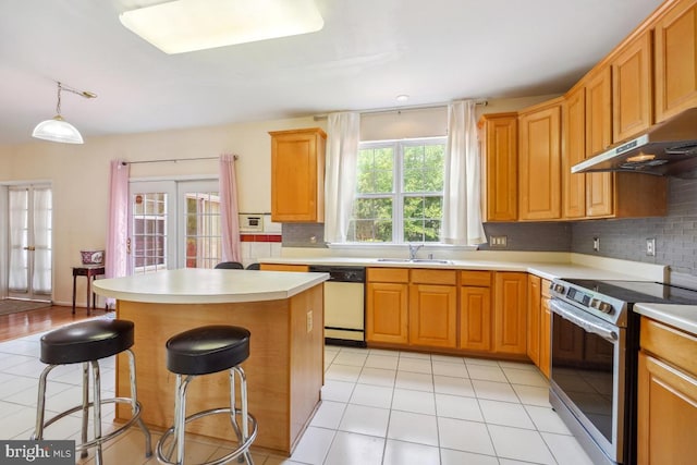 2363 Ashford Dr, Waldorf, MD 20603 - kitchen with dishwasher, stainless steel range with electric stovetop, under cabinet range hood, tasteful backsplash, and light countertops