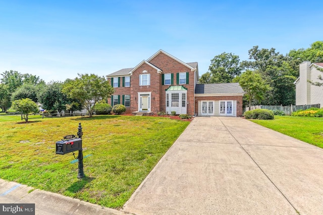 2363 Ashford Dr, Waldorf, MD 20603 - traditional home featuring driveway and brick siding