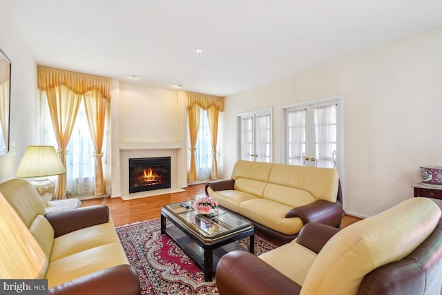 2363 Ashford Dr, Waldorf, MD 20603 - living area with wood finished floors and a fireplace with flush hearth