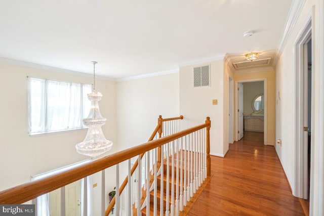 2363 Ashford Dr, Waldorf, MD 20603 - hall featuring an upstairs landing, light wood-style flooring, and ornamental molding
