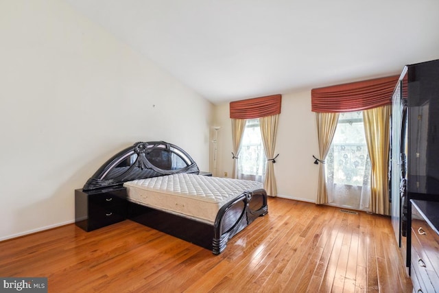 2363 Ashford Dr, Waldorf, MD 20603 - bedroom featuring light wood-style floors and vaulted ceiling