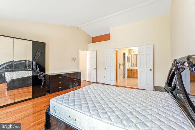 2363 Ashford Dr, Waldorf, MD 20603 - bedroom featuring vaulted ceiling and light wood finished floors