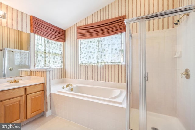 2363 Ashford Dr, Waldorf, MD 20603 - bathroom with wallpapered walls, a garden tub, a stall shower, vanity, and lofted ceiling