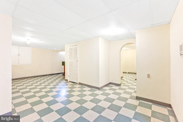 2363 Ashford Dr, Waldorf, MD 20603 - spare room featuring arched walkways, tile patterned floors, and a paneled ceiling