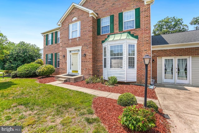 2363 Ashford Dr, Waldorf, MD 20603 - view of front of home featuring brick siding and a front yard
