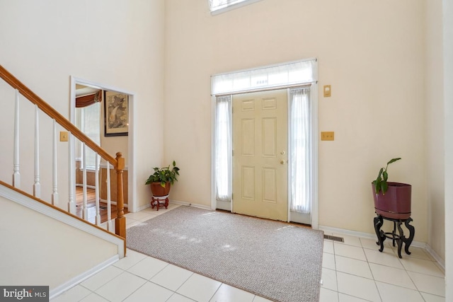 2363 Ashford Dr, Waldorf, MD 20603 - foyer featuring a high ceiling, stairs, and light tile patterned floors