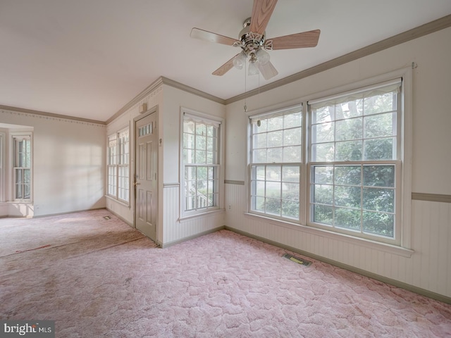 15069 Maple Glen Ct, Dumfries, VA 22025 - spare room featuring healthy amount of natural light, a wainscoted wall, ceiling fan, carpet flooring, and ornamental molding