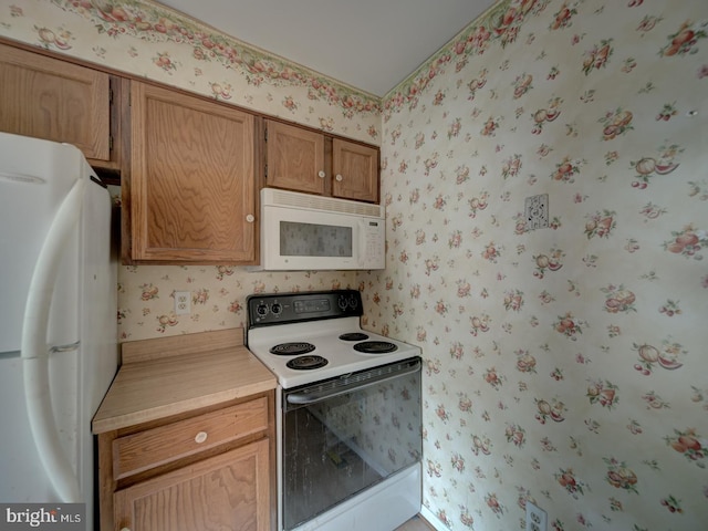 15069 Maple Glen Ct, Dumfries, VA 22025 - kitchen featuring white appliances, wallpapered walls, and light countertops