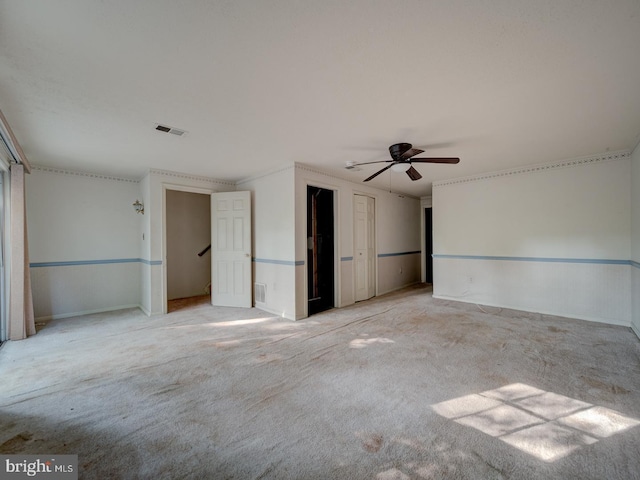 15069 Maple Glen Ct, Dumfries, VA 22025 - unfurnished bedroom featuring light carpet, multiple closets, and a ceiling fan