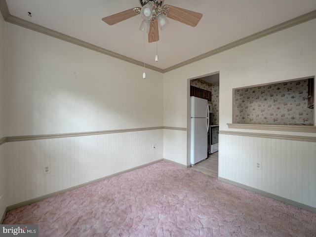 15069 Maple Glen Ct, Dumfries, VA 22025 - empty room with wainscoting, crown molding, ceiling fan, and light colored carpet