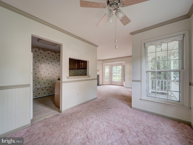 15069 Maple Glen Ct, Dumfries, VA 22025 - unfurnished living room featuring ornamental molding, light colored carpet, ceiling fan, and wainscoting