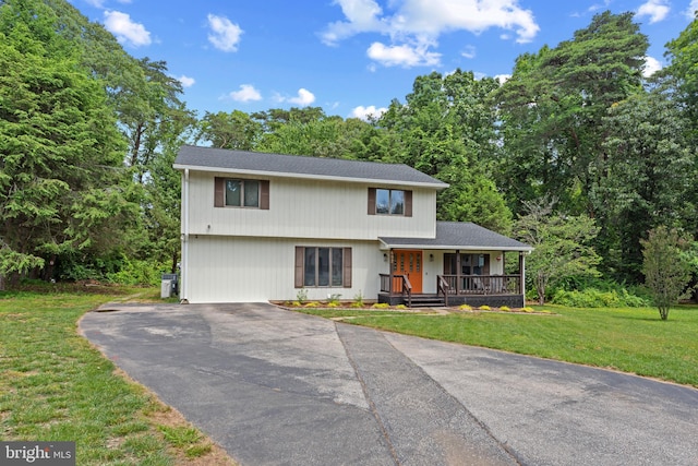 602 Sweet Brush Ct, Severna Park, MD 21146 - colonial inspired home featuring a porch, asphalt driveway, and a front lawn