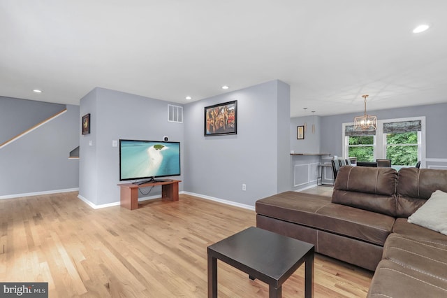 6430 Wishbone Ter, Cabin John, MD 20818 - living area featuring light wood-style floors, recessed lighting, a chandelier, and stairway