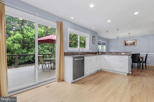 6430 Wishbone Ter, Cabin John, MD 20818 - kitchen featuring dishwasher, light wood finished floors, white cabinets, a chandelier, and a peninsula