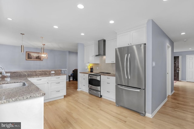 6430 Wishbone Ter, Cabin John, MD 20818 - kitchen featuring appliances with stainless steel finishes, wall chimney exhaust hood, white cabinets, light wood-style flooring, and recessed lighting