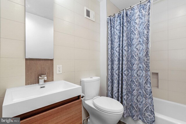 6430 Wishbone Ter, Cabin John, MD 20818 - full bathroom with tile walls, vanity, and shower / bathtub combination with curtain