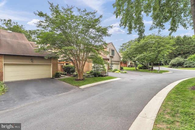 6430 Wishbone Ter, Cabin John, MD 20818 - obstructed view of property featuring brick siding and asphalt driveway