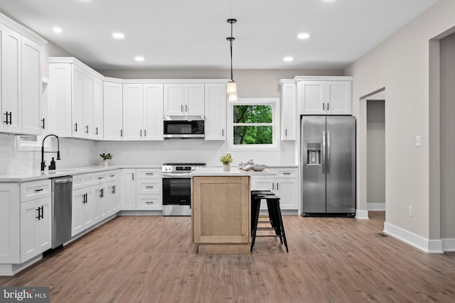 2725 S Sunset Ave, Williamstown, NJ 08094 - kitchen with appliances with stainless steel finishes, light wood finished floors, recessed lighting, light countertops, and white cabinetry