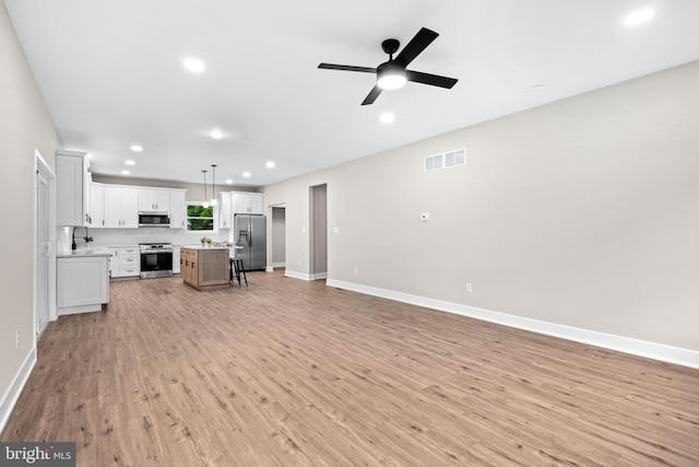 2725 S Sunset Ave, Williamstown, NJ 08094 - unfurnished living room with light wood-style flooring, recessed lighting, and a ceiling fan