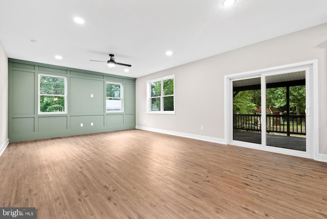 2725 S Sunset Ave, Williamstown, NJ 08094 - empty room featuring wood finished floors, ceiling fan, recessed lighting, and a decorative wall
