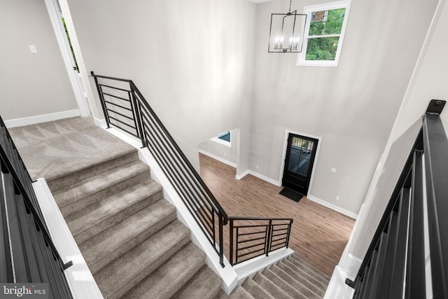 2725 S Sunset Ave, Williamstown, NJ 08094 - staircase featuring a chandelier and wood finished floors