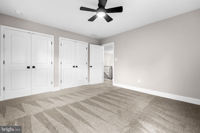 2725 S Sunset Ave, Williamstown, NJ 08094 - unfurnished bedroom featuring two closets, carpet flooring, and a ceiling fan
