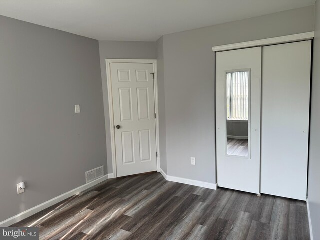 225 Barclay Ct, West Deptford, NJ 08051 - unfurnished bedroom with dark wood finished floors, a closet, and baseboards