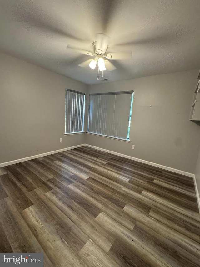 225 Barclay Ct, West Deptford, NJ 08051 - unfurnished room featuring dark wood-style floors, a textured ceiling, baseboards, and ceiling fan