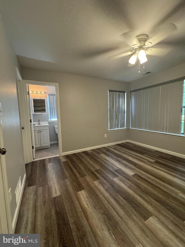 225 Barclay Ct, West Deptford, NJ 08051 - unfurnished room featuring dark wood-type flooring, baseboards, ceiling fan, and healthy amount of natural light