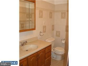 bathroom with vanity and tile patterned flooring