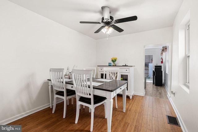 1228 S 22nd St, Philadelphia, PA 19146 - dining room with light wood-style flooring and a ceiling fan