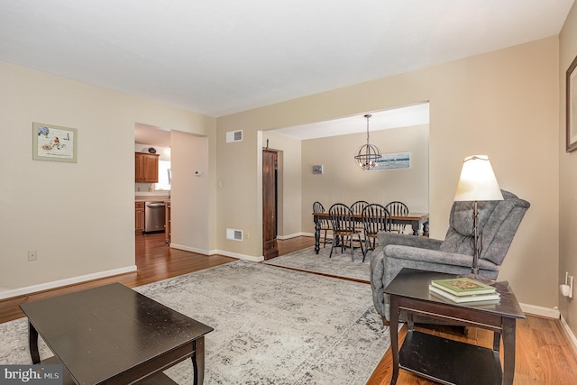 14 Cedarfield Dr, Gettysburg, PA 17325 - living area with wood finished floors and a chandelier