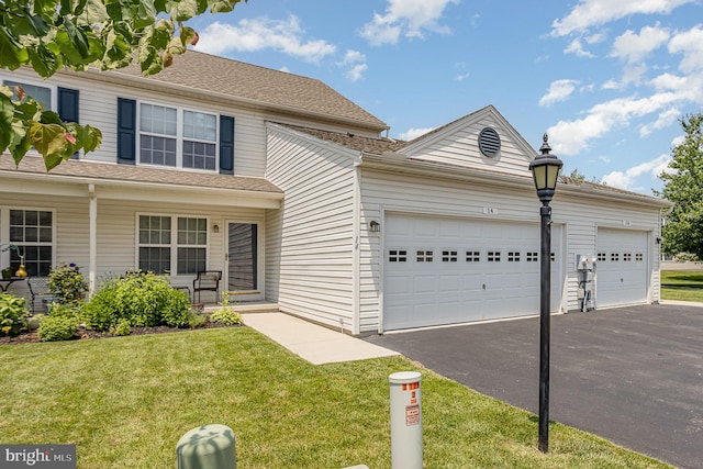 14 Cedarfield Dr, Gettysburg, PA 17325 - traditional-style home with driveway, a garage, a front lawn, and covered porch