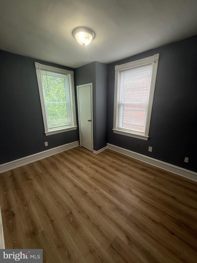 48 S 7th St, Darby, PA 19023 - unfurnished bedroom with wood finished floors and baseboards