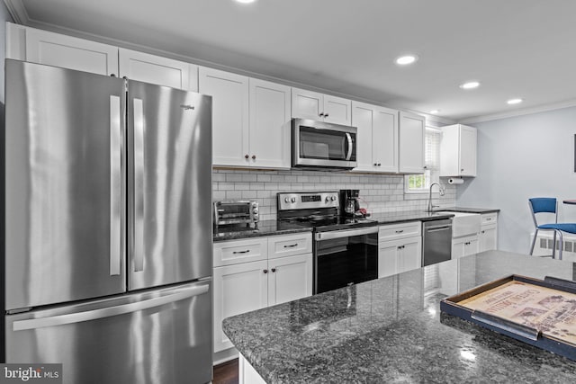440 E Magnolia Dr, Morrisville, PA 19067 - kitchen with appliances with stainless steel finishes, crown molding, white cabinetry, recessed lighting, and tasteful backsplash