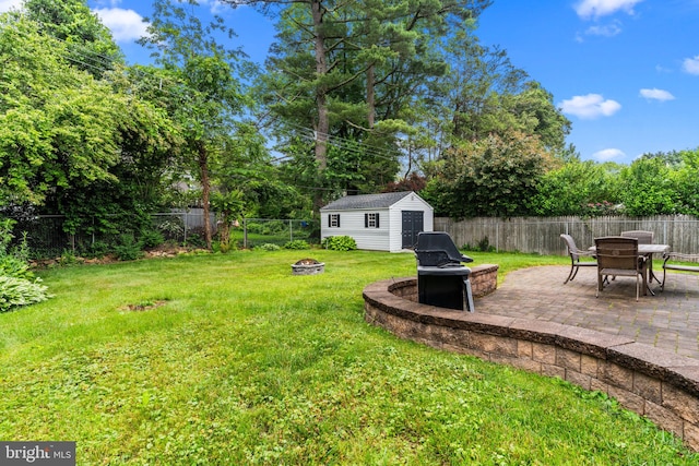 440 E Magnolia Dr, Morrisville, PA 19067 - fenced backyard with a fire pit, a patio area, and an outdoor structure