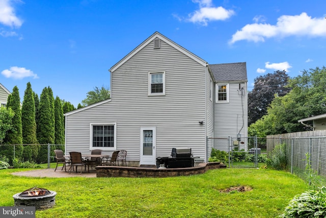 440 E Magnolia Dr, Morrisville, PA 19067 - back of house with a fire pit, a fenced backyard, a patio area, and a gate