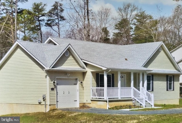 1362 Solomons Island Rd, Huntingtown, MD 20639 - view of front of house featuring a porch, roof with shingles, and a garage