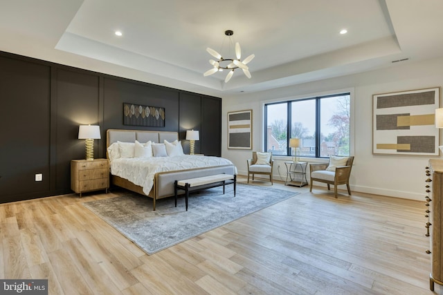 6400 26th St N, Arlington, VA 22207 - bedroom with a tray ceiling, a chandelier, light wood-type flooring, and recessed lighting