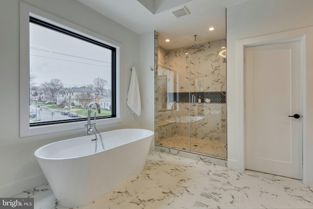 6400 26th St N, Arlington, VA 22207 - bathroom featuring a marble finish shower, a freestanding bath, marble finish floors, and recessed lighting