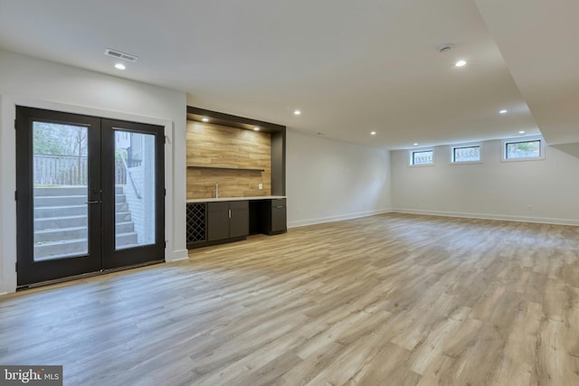 6400 26th St N, Arlington, VA 22207 - unfurnished living room with french doors, light wood finished floors, and recessed lighting