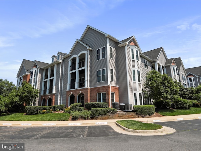 46598 Drysdale Ter Unit 302, Sterling, VA 20165 - view of building exterior with uncovered parking