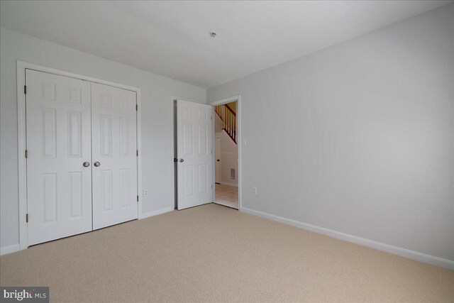 2222 Commissary Cir Unit 198, Odenton, MD 21113 - unfurnished bedroom with light carpet and a closet