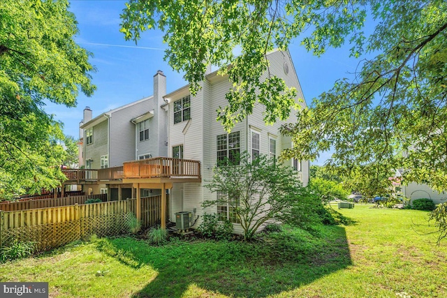 2222 Commissary Cir Unit 198, Odenton, MD 21113 - back of property with a lawn and a wooden deck