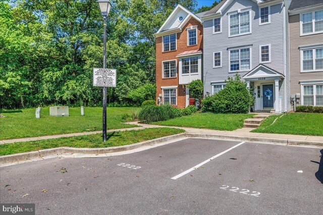 2222 Commissary Cir Unit 198, Odenton, MD 21113 - view of property with uncovered parking and a front yard