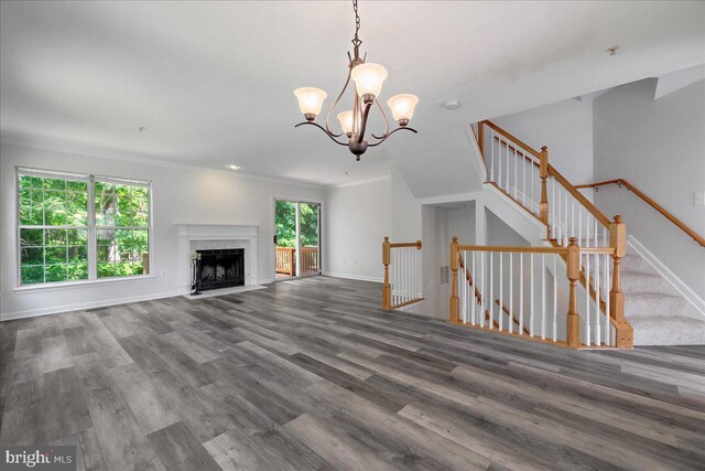 2222 Commissary Cir Unit 198, Odenton, MD 21113 - unfurnished living room featuring a chandelier, wood finished floors, and a premium fireplace